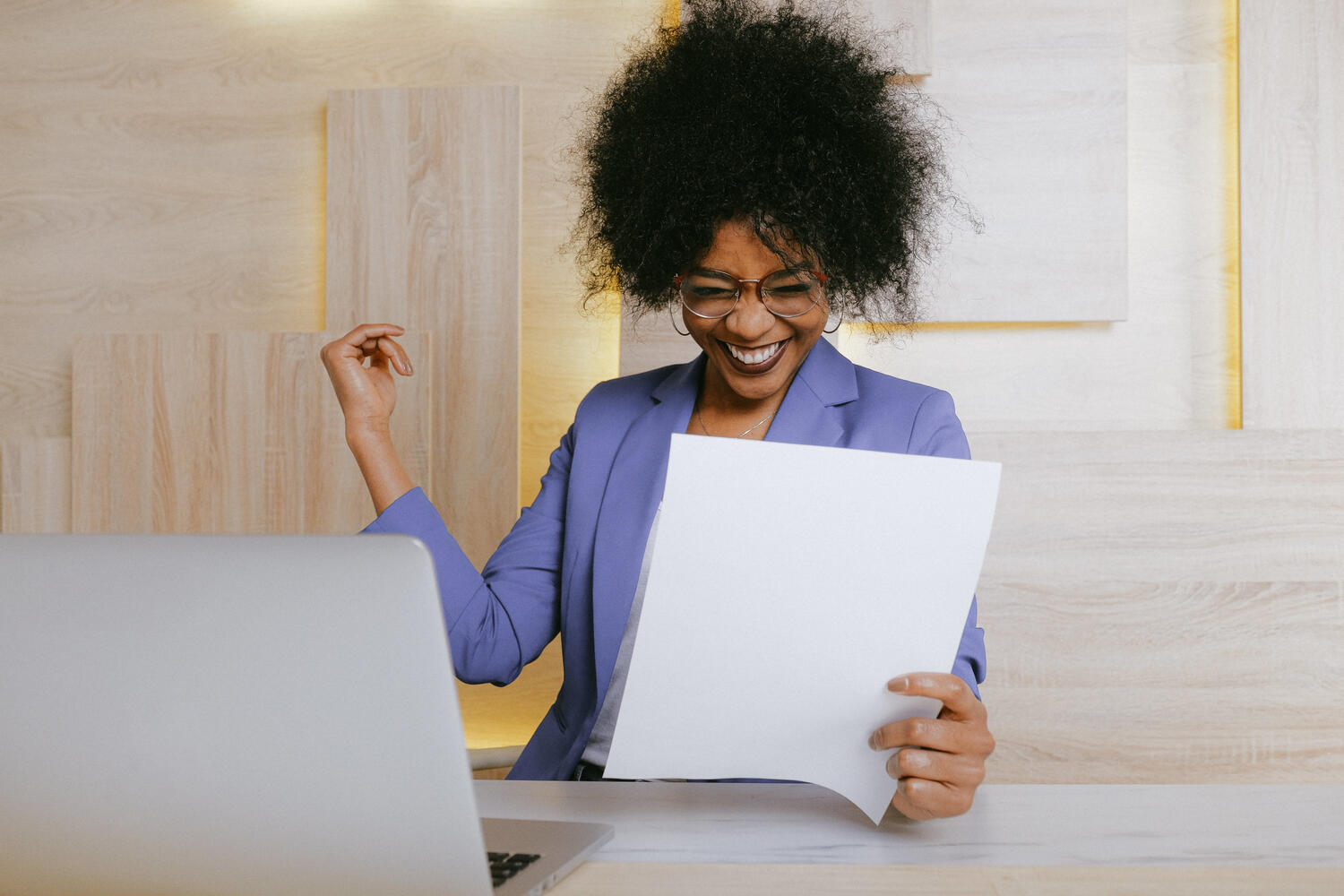 Smiling woman reading a resume