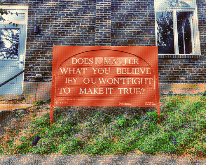 Orange replacable letter sign reading "Does it matter what you believe if you won't fight to make it true?"